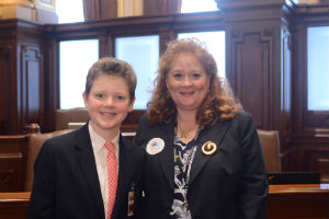 Will Fehrman, 14, of Park Ridge joins Senator Laura Murphy (D-Des Plaines) on the floor of the Illinois Senate on Wednesday, Feb. 28, 2018.